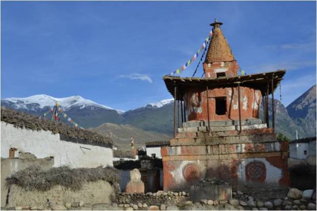 Chorten and snow capped peaks